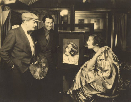 The artist Henry Clive (far left in hat), with Joan Crawford and a recently completed pastel illustration - C. 1930. 