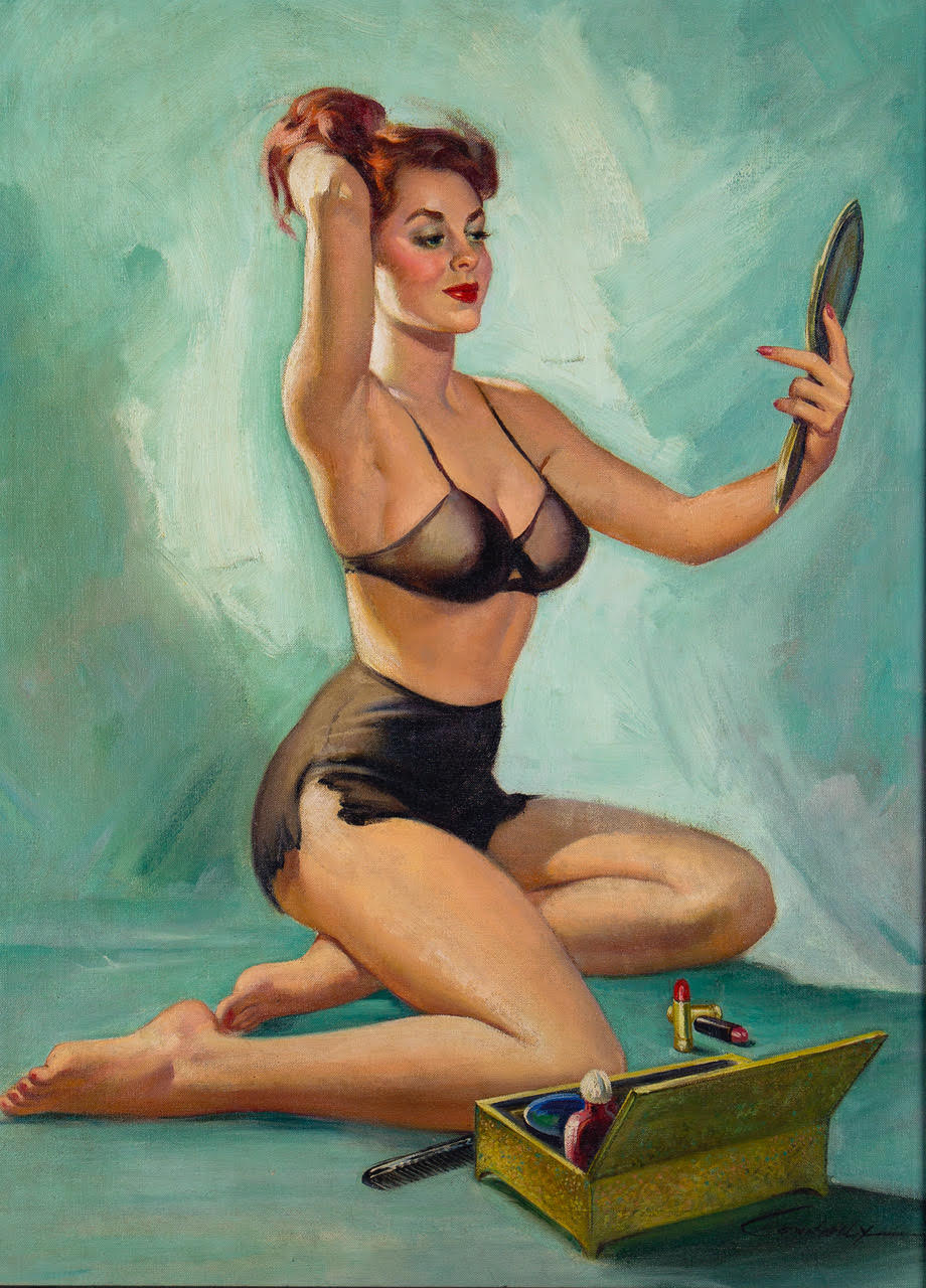Redheaded pin-up girl wearing black undergarments, seated on the ground in front of a makeup case, and admiring her visage in a handheld mirror.